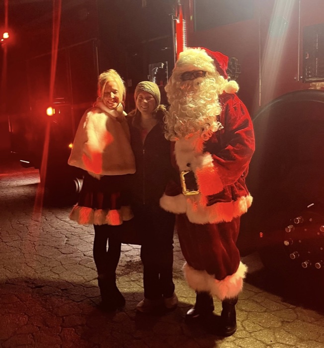 Amber with Santa at holiday celebration